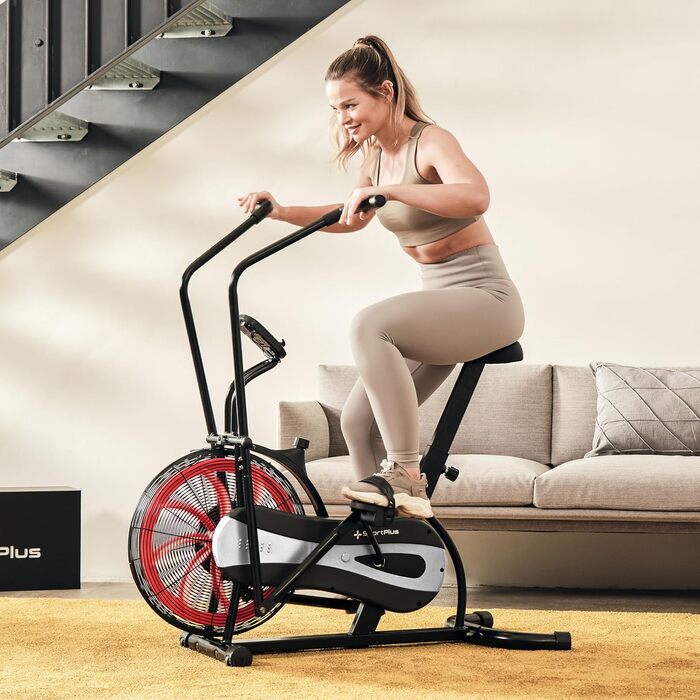 Велотренажер SportPlus Air Bike з повітряним опором, сумісний з додатком, для HIIT, домашній фітнес, підсвічування дисплея, навантаження до 100 кг, чорний/червоний, не підтримує додатки